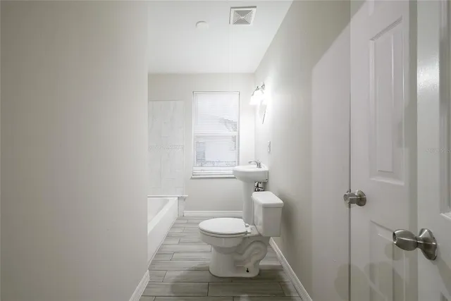 a bathroom with a toilet