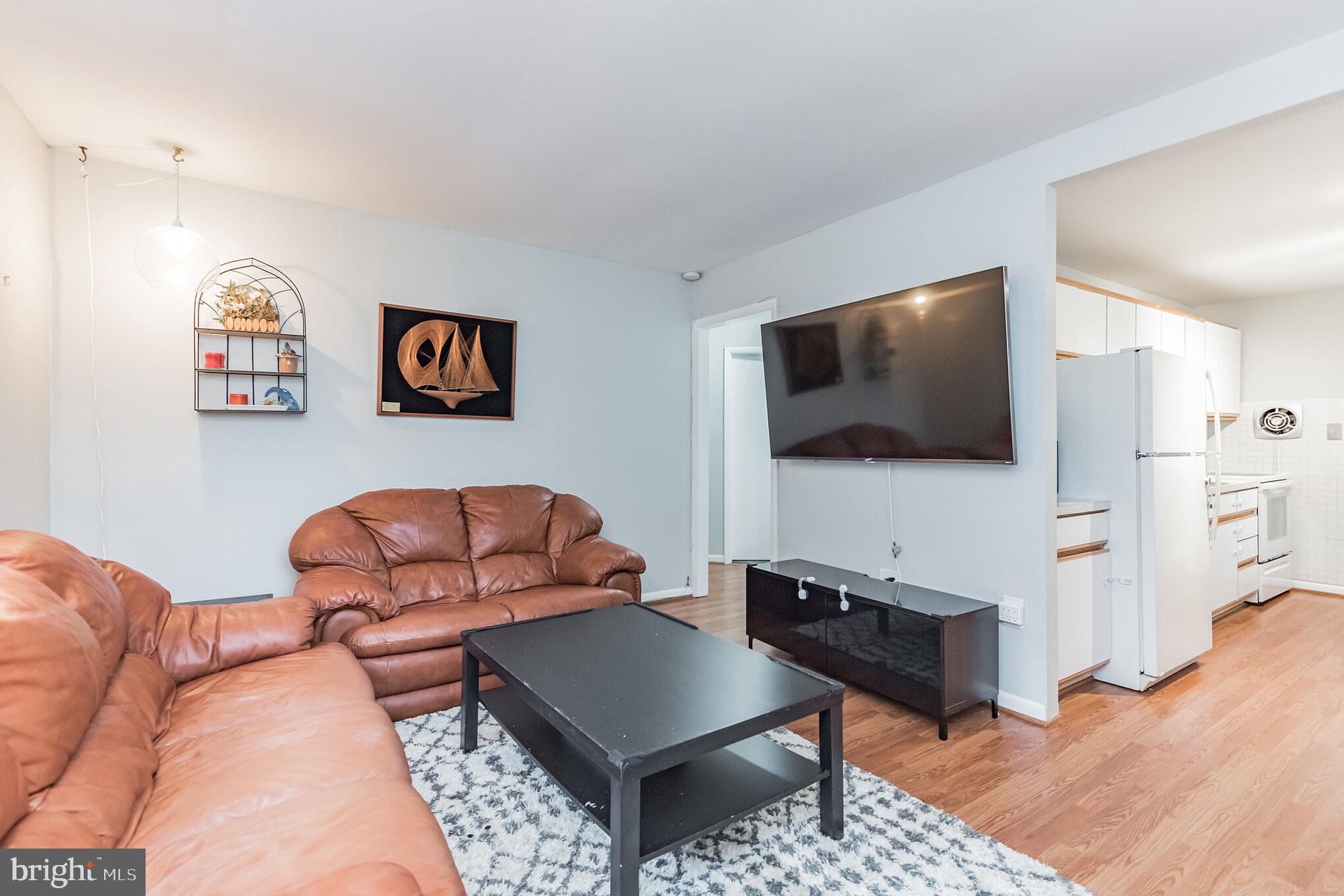 1729 Ridgely Road Edgewater, MD 21037 - Photo 15 of 29 a living room with furniture and a flat screen tv