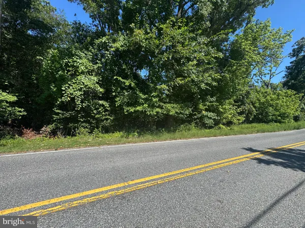 a view of a field with an outdoor space