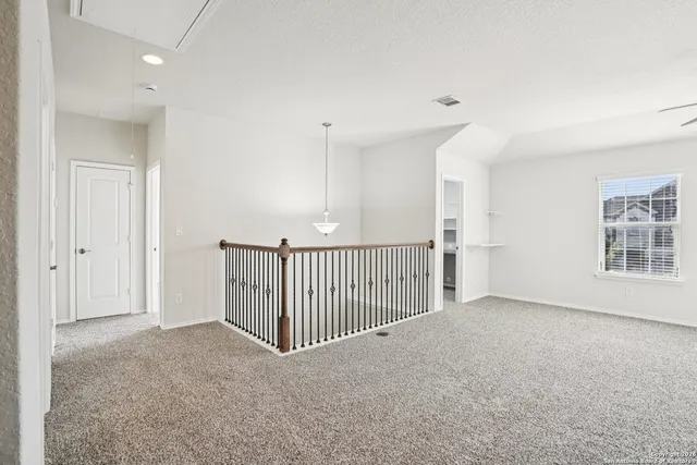 a view of a hallway with a livingroom