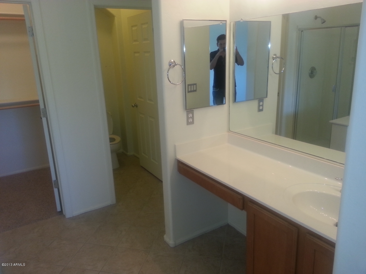 44395 Cypress Lane Maricopa, AZ 85138 - Photo 18 of 20 a bathroom with a sink and mirror