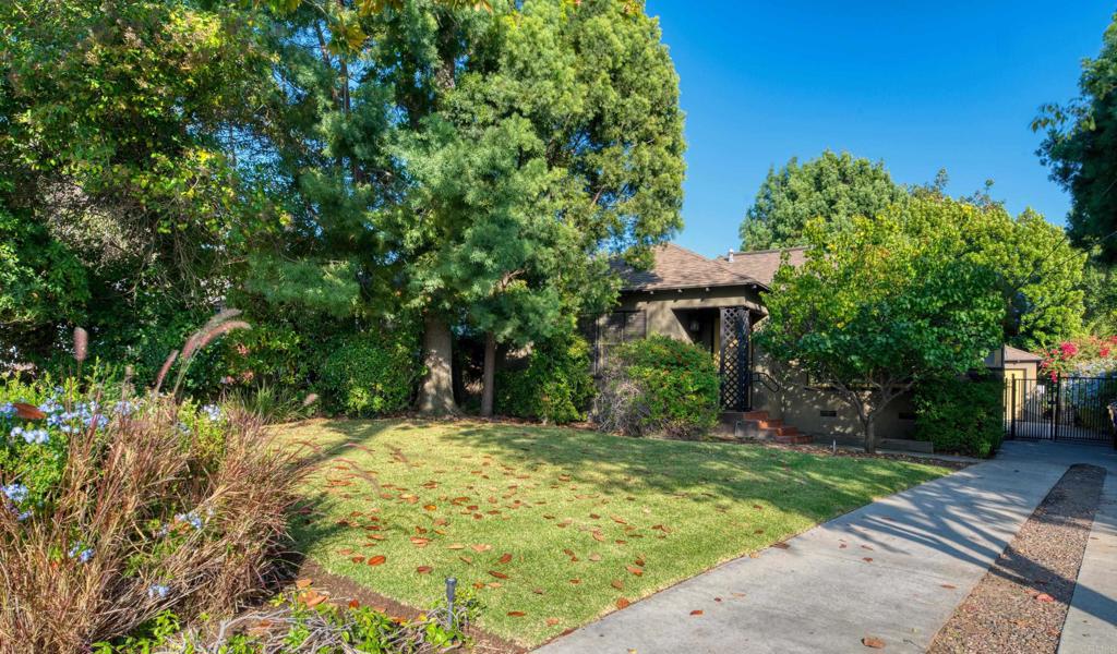 a view of a house with a tree