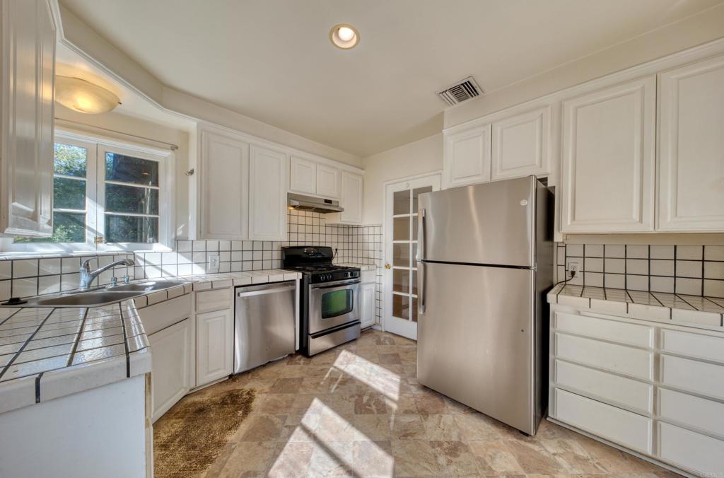 444 North Myrtle Avenue Monrovia, CA 91016 - Photo 15 of 37 a kitchen with a refrigerator stove and sink