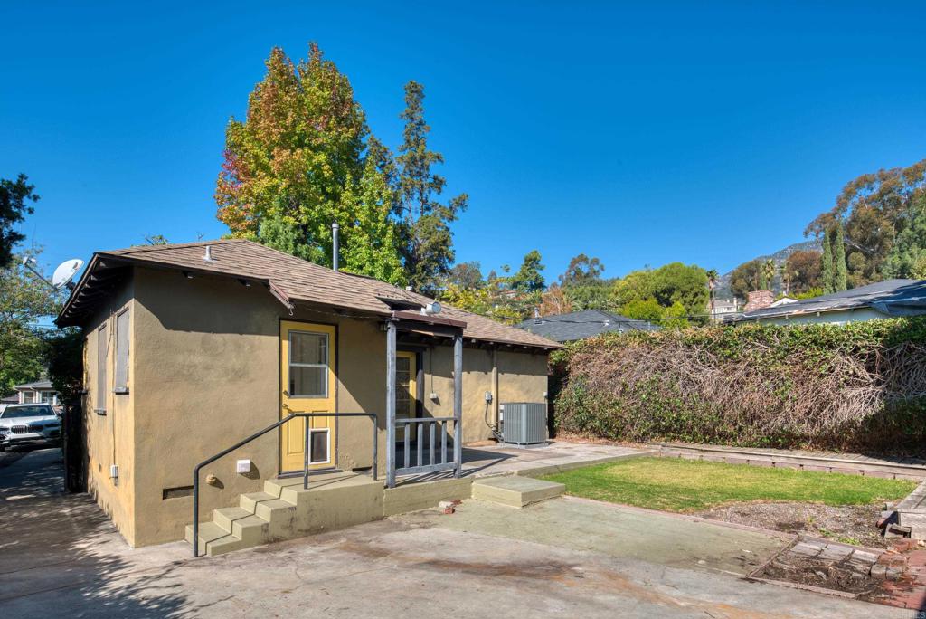 444 North Myrtle Avenue Monrovia, CA 91016 - Photo 23 of 37 a front view of a house with a yard and garage