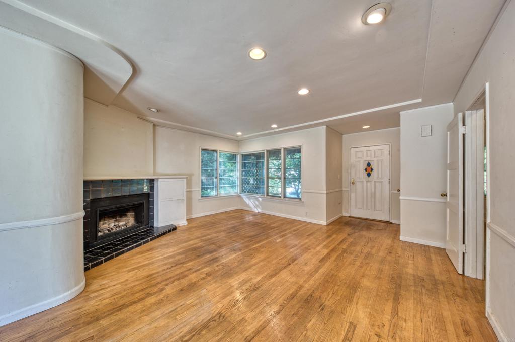 444 North Myrtle Avenue Monrovia, CA 91016 - Photo 5 of 37 a view of empty room with wooden floor and fireplace