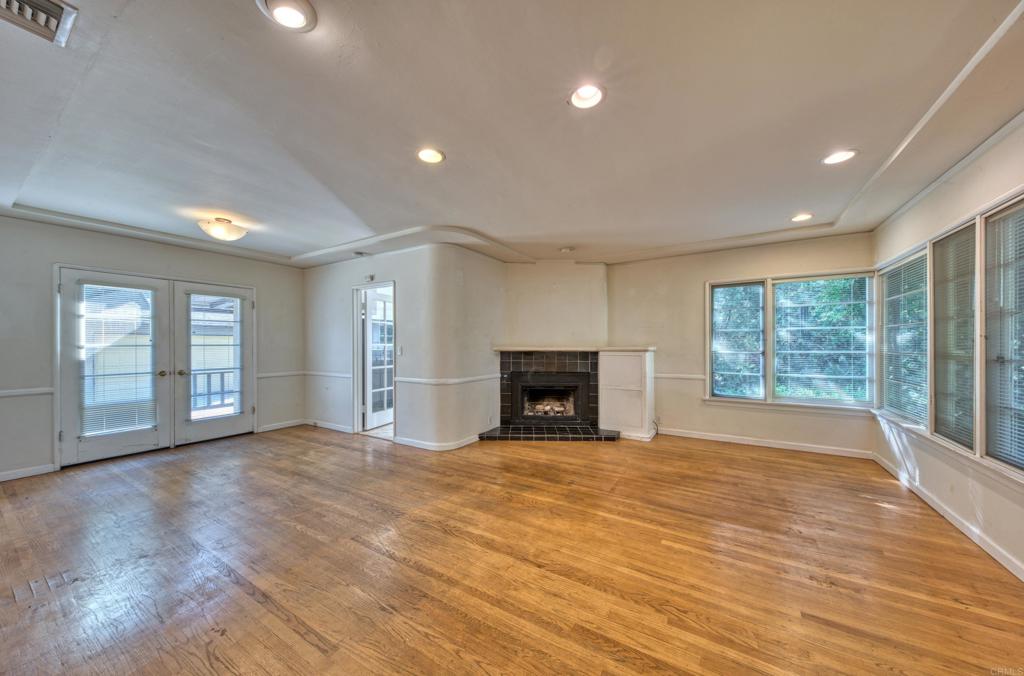 444 North Myrtle Avenue Monrovia, CA 91016 - Photo 6 of 37 a view of an empty room with a fireplace and a large window