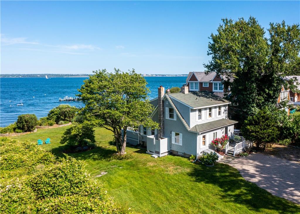 Carefree coastal living from this charming waterfront ome on Narragansett Bay