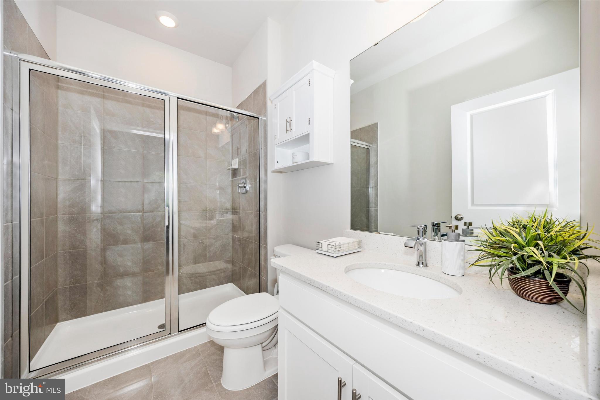 700 Bond Street Frederick, MD 21701 - Photo 16 of 49 a bathroom with a sink a toilet and shower