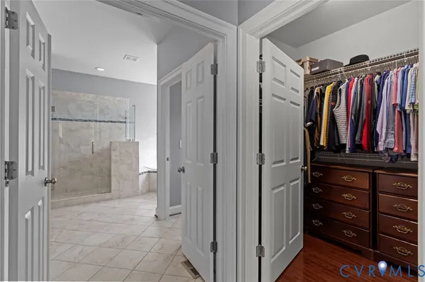 a bathroom with a bathtub and a shower