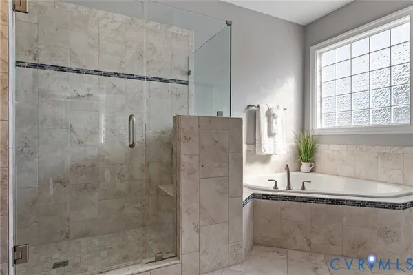 a spacious bathroom with a granite countertop sink a mirror and a