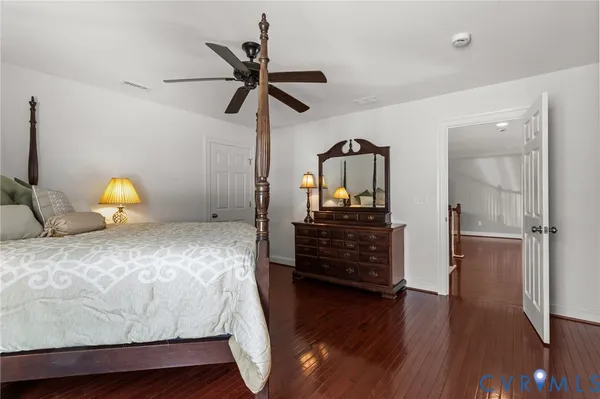 a bedroom with bed and window