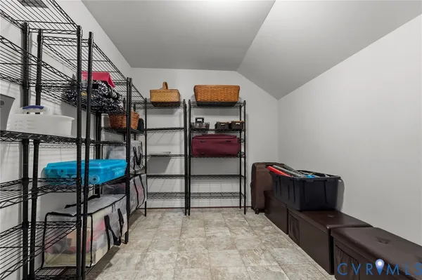 a view of a hallway with wooden floor and windows