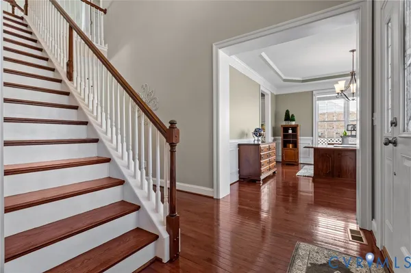 a kitchen with stainless steel appliances granite countertop a stove and a wooden floors