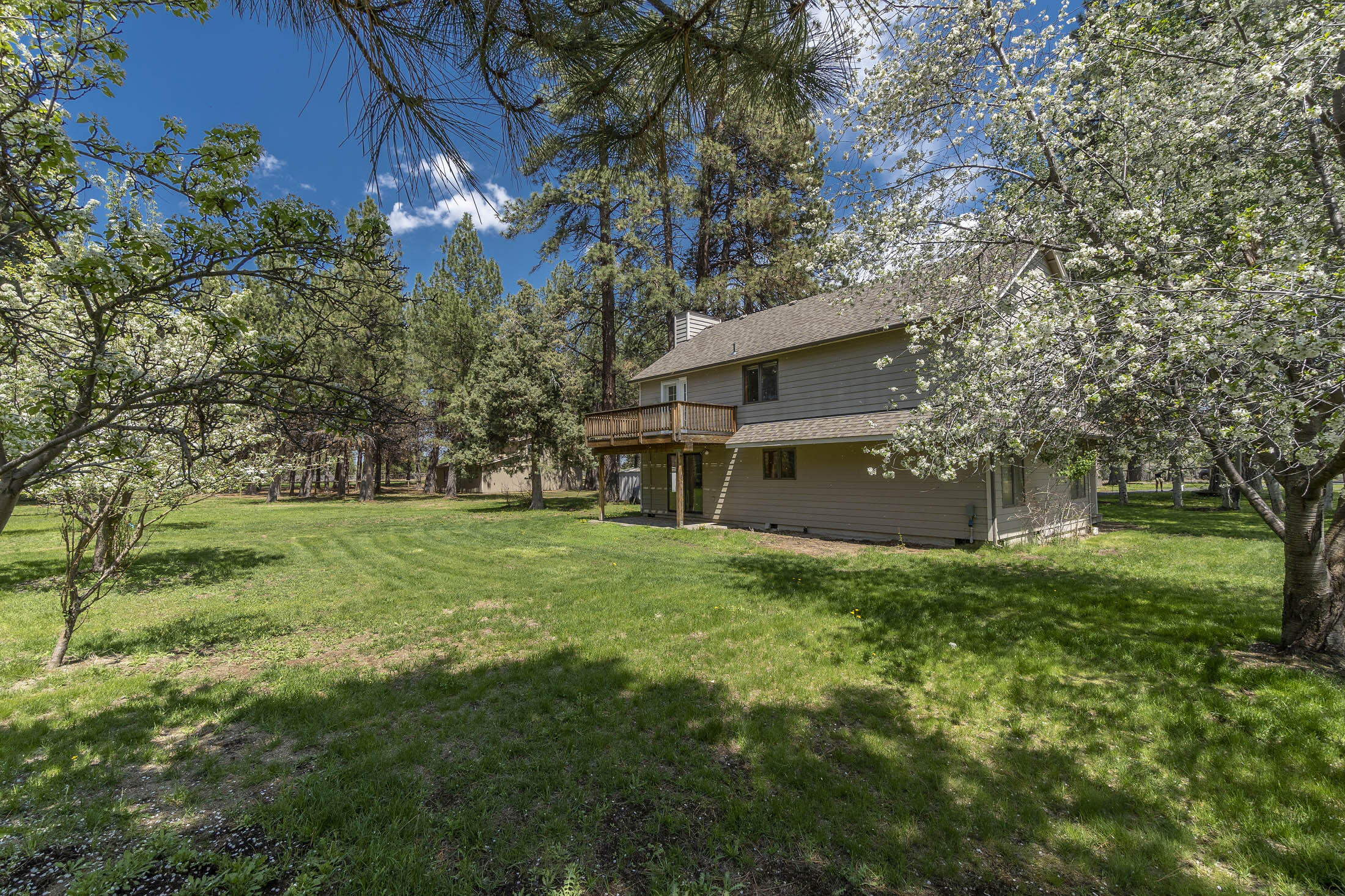 60603 Woodside Road Bend, OR 97702 - Photo 6 of 36 a view of a house with a yard