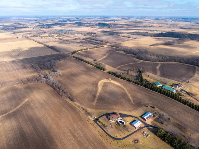 an aerial view of residential houses with outdoor space