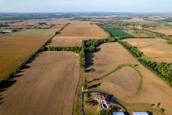 an aerial view of residential houses with outdoor space
