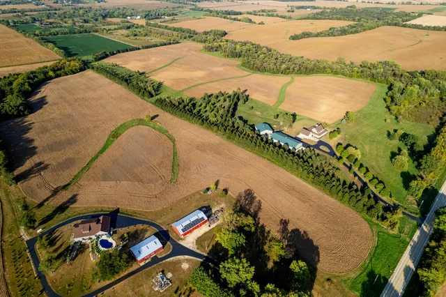 an aerial view of a house and outdoor space