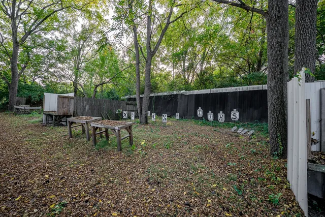 a bathroom with a shower and a sink