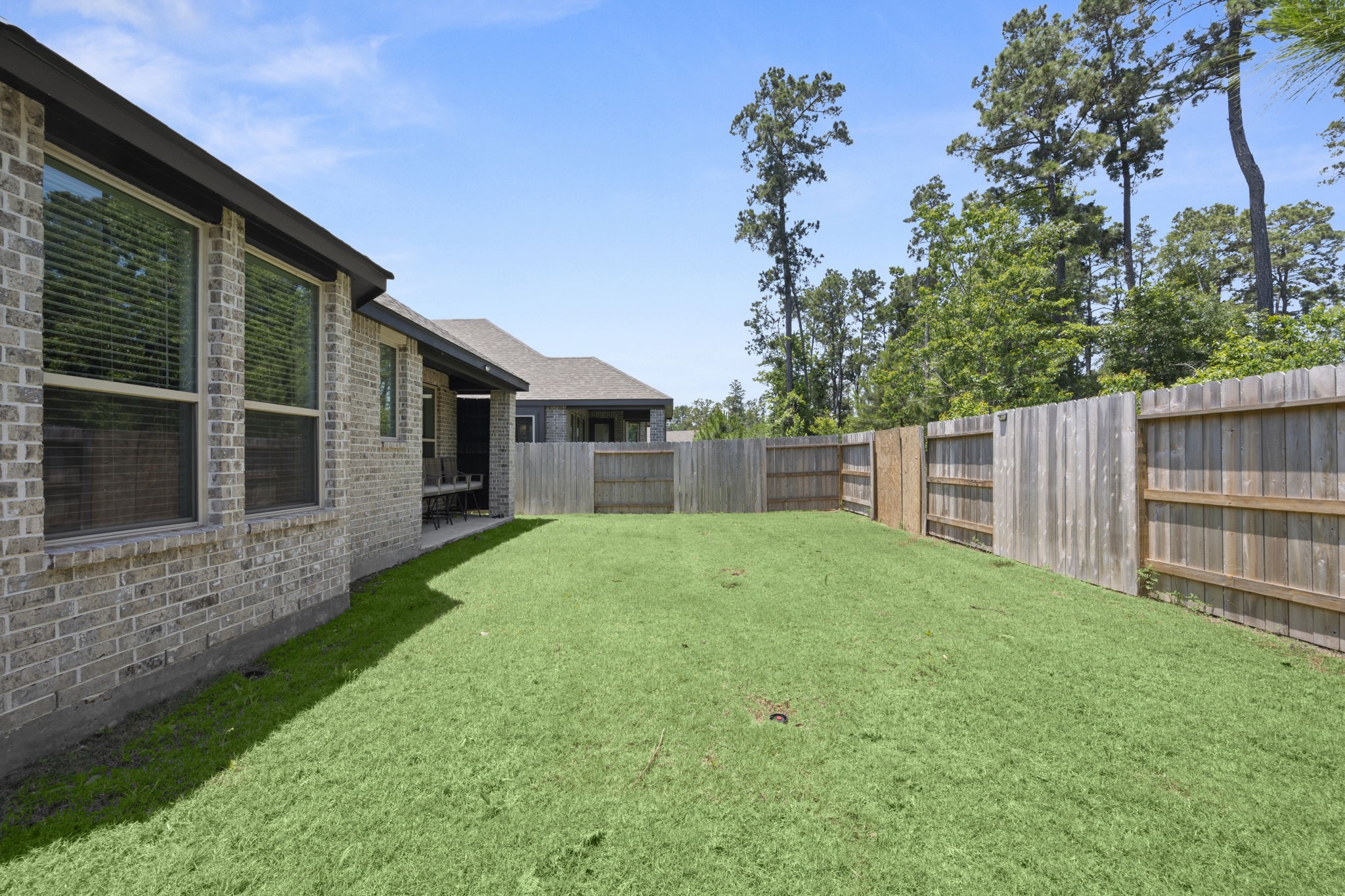 13035 Wandering Rdg Lane Conroe, TX 77302 - Photo 28 of 28 a view of a backyard with plants and large tree