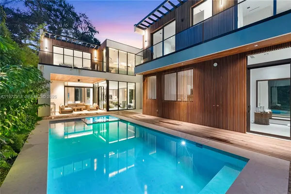 a view of swimming pool with outdoor seating