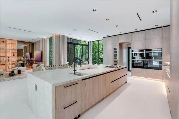 a bathroom with sink shower and mirror