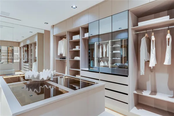 a kitchen with a refrigerator and a sink