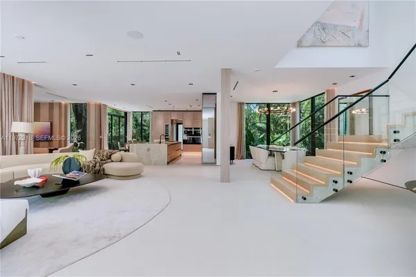 a large room with a large window and couch