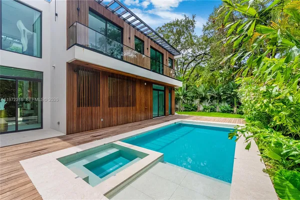 a view of backyard with large trees