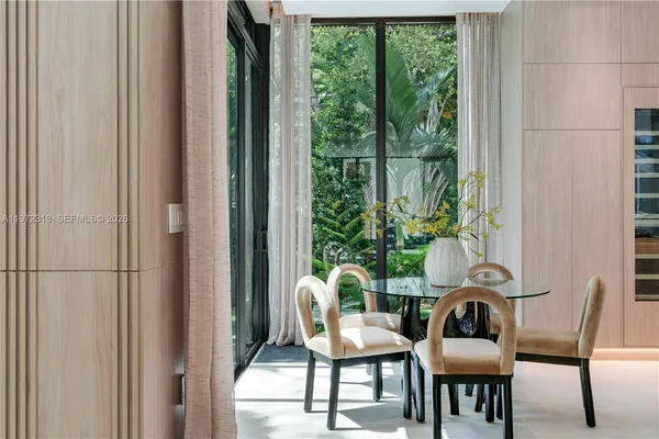 a view of a chairs and table in the balcony