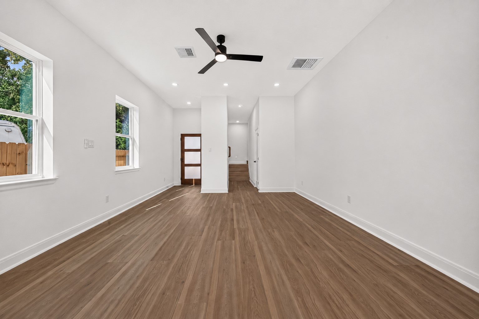 8110 Carver Road Houston, TX 77088 - Photo 12 of 38 Generously sized living and dining area offering plenty of room to create distinct spaces for relaxing, dining, and gathering.