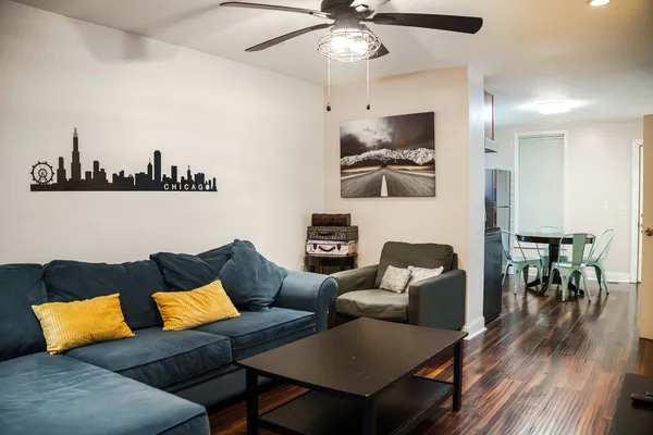 a living room with furniture and a flat screen tv
