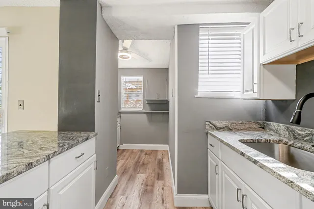 a kitchen with a sink stove and refrigerator