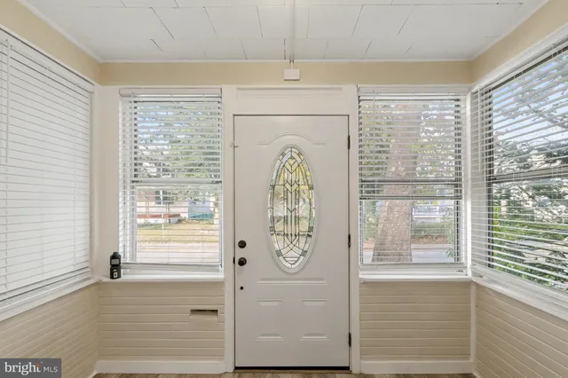 a view of entryway with wooden floor