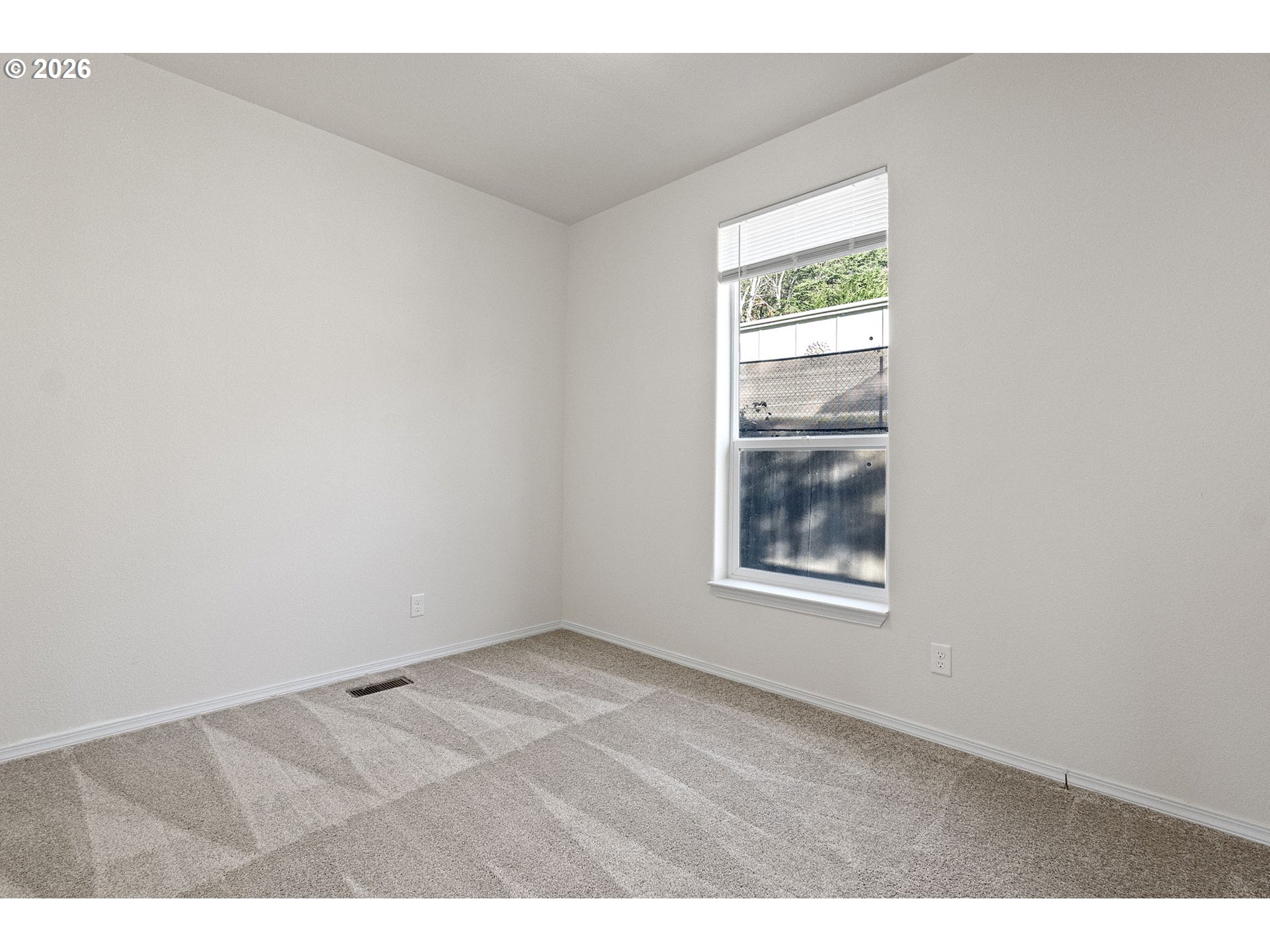 98041 Hallway Road, Unit 19 Brookings, OR 97415 - Photo 13 of 20 an empty room with a window