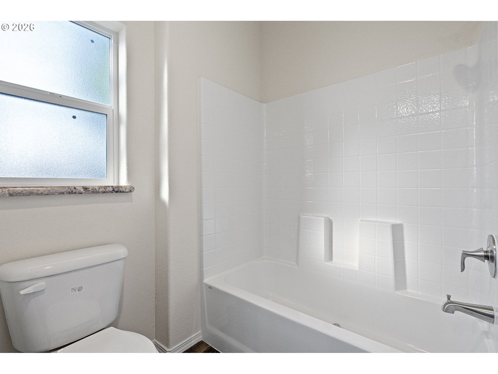 98041 Hallway Road, Unit 19 Brookings, OR 97415 - Photo 15 of 20 a bathroom with a toilet a sink and mirror