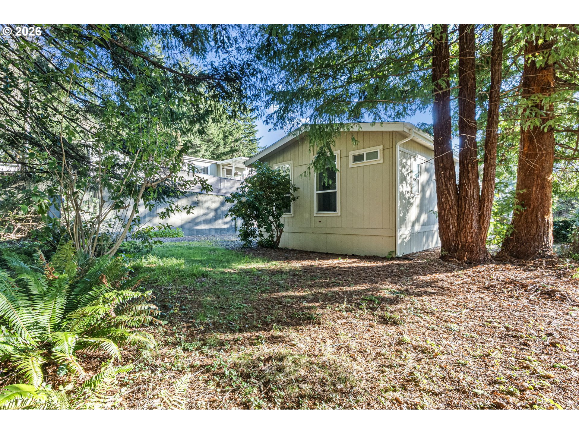 98041 Hallway Road, Unit 19 Brookings, OR 97415 - Photo 19 of 20 a view of a house with a yard