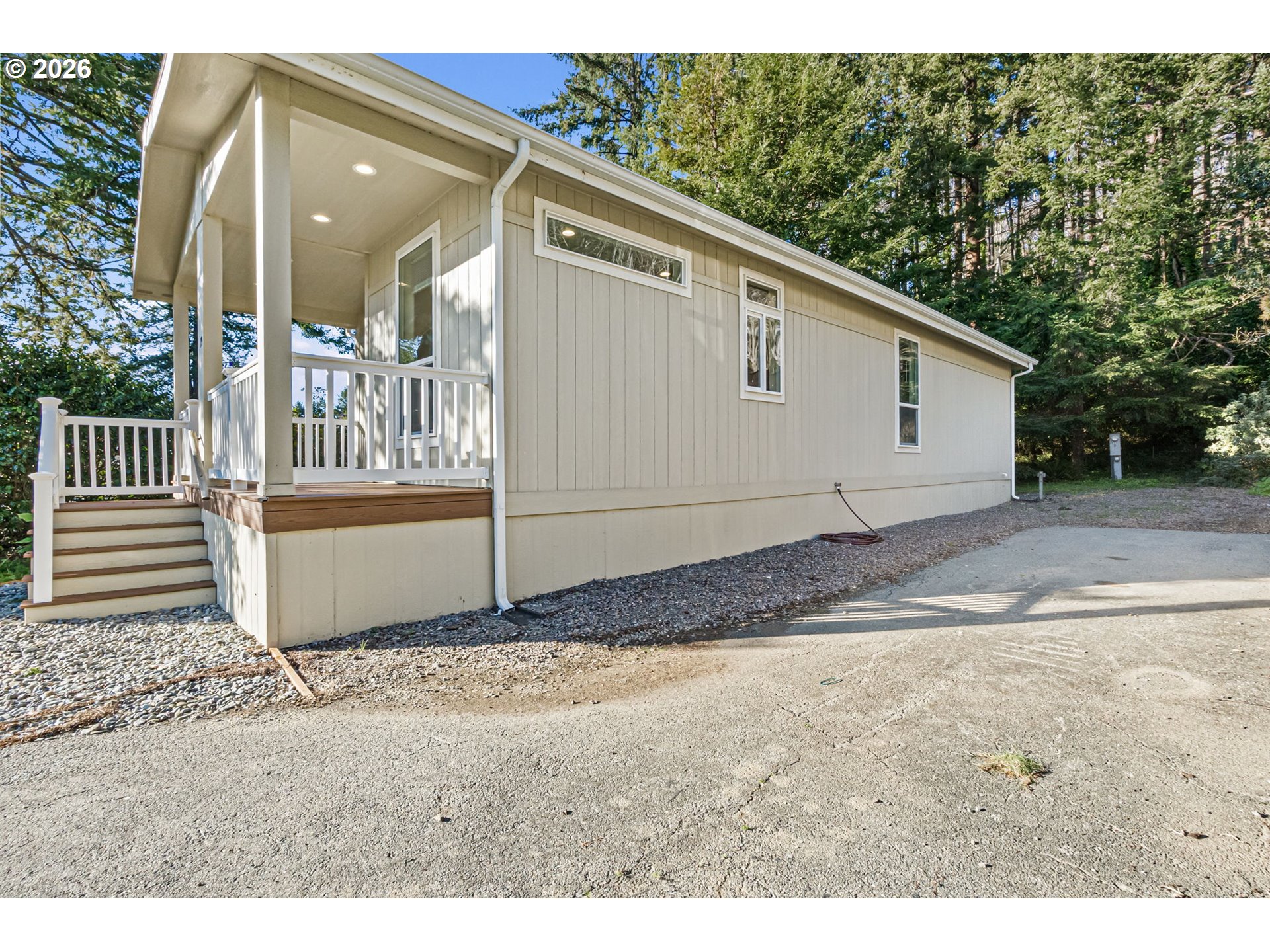 98041 Hallway Road, Unit 19 Brookings, OR 97415 - Photo 20 of 20 a view of a house with a backyard
