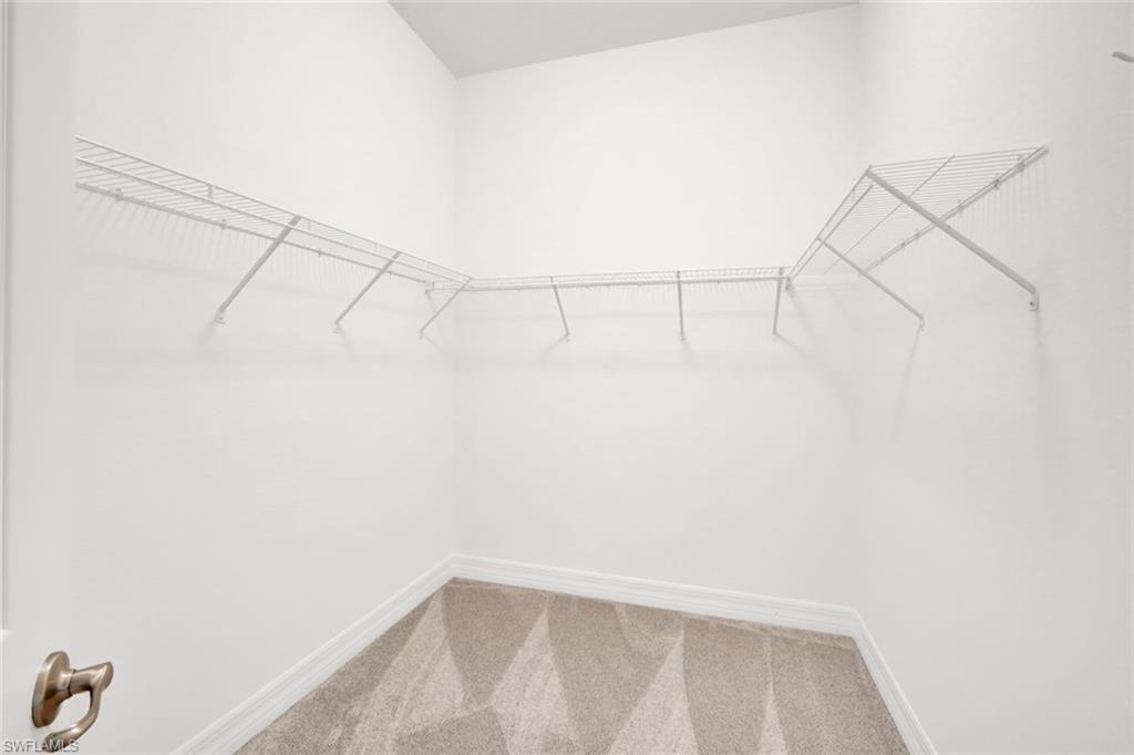 6526 Monterey Point, Unit 101 Naples, FL 34105 - Photo 12 of 20 a view of a rack on the wall