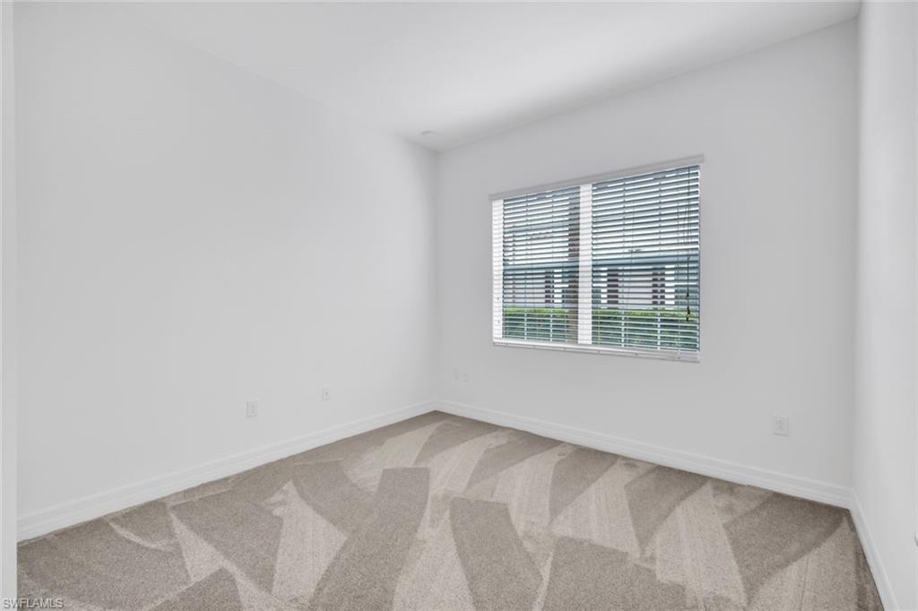 6526 Monterey Point, Unit 101 Naples, FL 34105 - Photo 15 of 20 a view of an empty room with a window