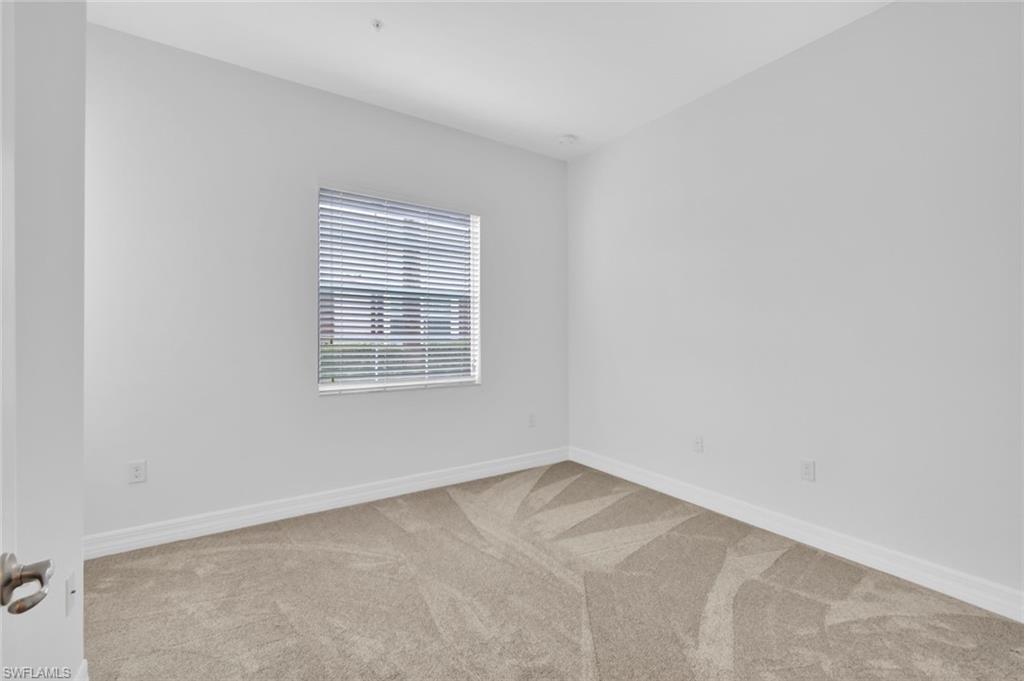 6526 Monterey Point, Unit 101 Naples, FL 34105 - Photo 16 of 20 an empty room with a window