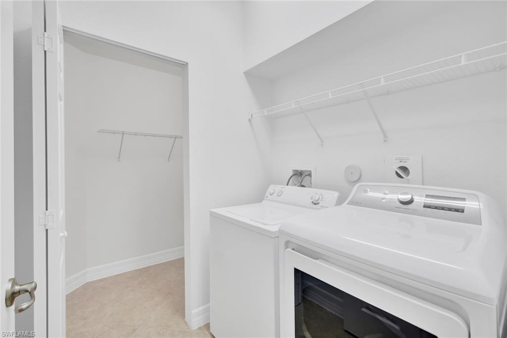 6526 Monterey Point, Unit 101 Naples, FL 34105 - Photo 17 of 20 a utility room with dryer and washer