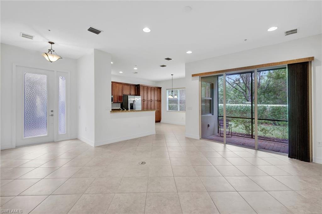 6526 Monterey Point, Unit 101 Naples, FL 34105 - Photo 4 of 20 a view of a livingroom with furniture and an entryway