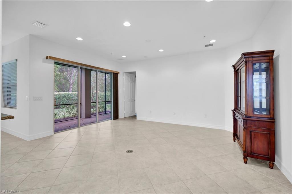 6526 Monterey Point, Unit 101 Naples, FL 34105 - Photo 5 of 20 a view of an entryway with wooden floor and cabinet