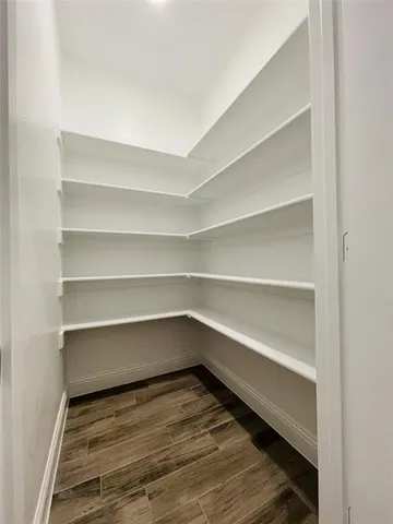 a storage room with wooden floor