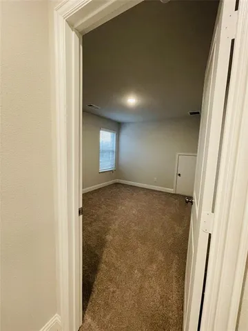 a view of a bathroom with double vanity sink a mirror and a bathtub