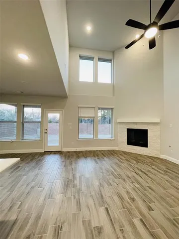 a kitchen with a sink a stove and a wooden floors