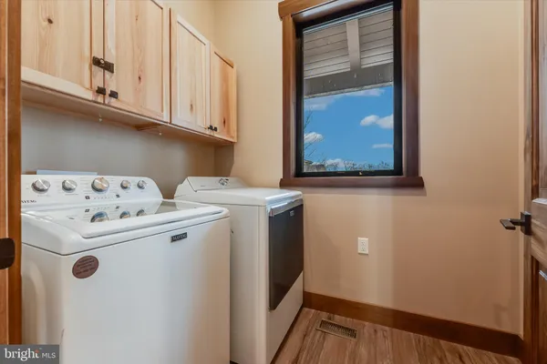 a view of a hallway with a livingroom and entryway