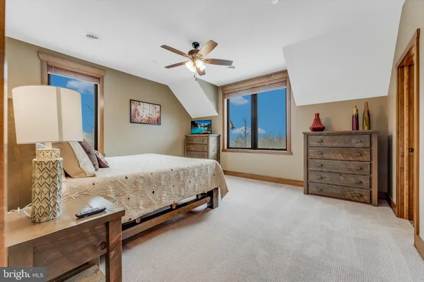 a bedroom with a bed and a dresser