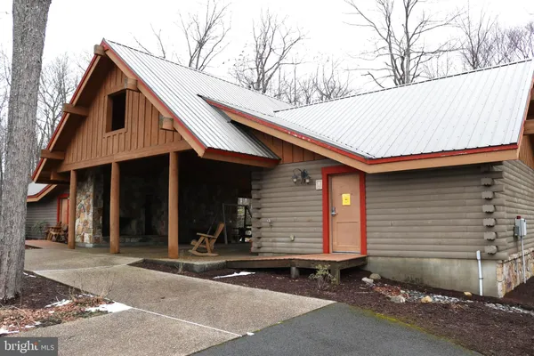 a big yard with lots of green space and trees
