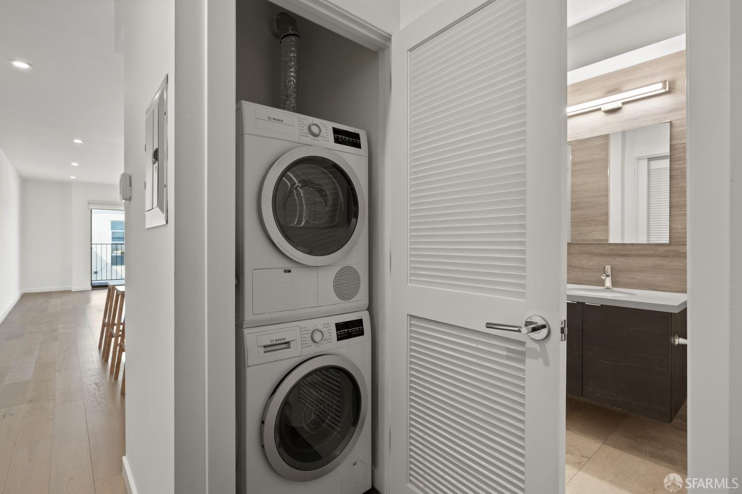 252 9th Street, Unit 503 San Francisco, CA 94103 - Photo 12 of 15 a view of a hallway with washer and dryer